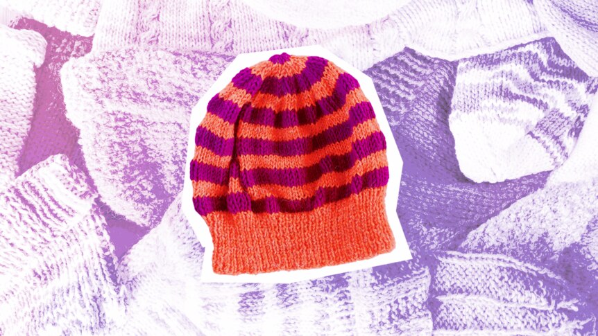A striped, knitted red and purple beanie.