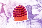 A striped, knitted red and purple beanie.