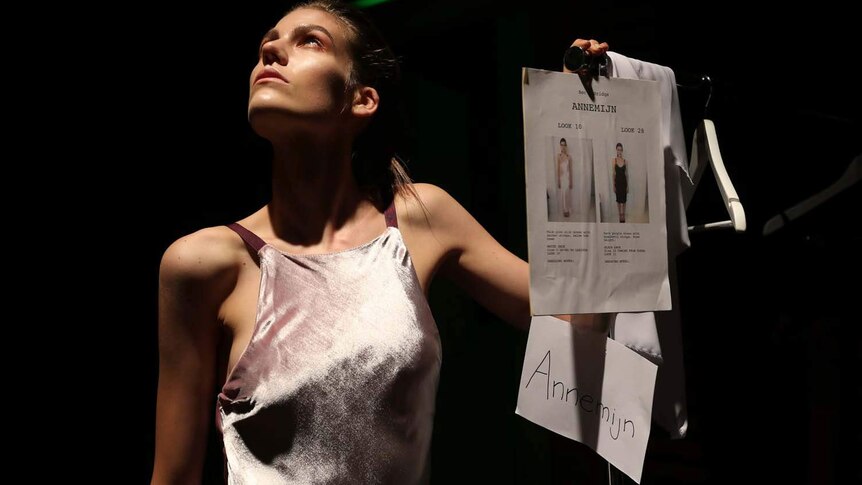 A model poses backstage at Australian Fashion Week in Sydney