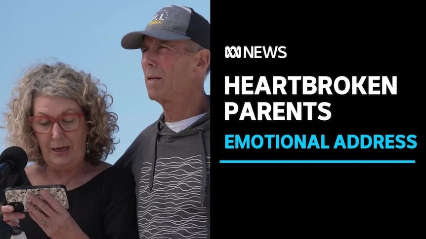 Heartbroken Parents, Emotional Address: A woman reads from a mobile phone while a man places his arm around her shoulders.
