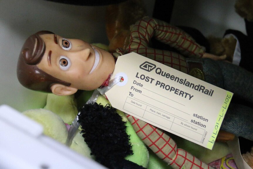 Woody toy from Toy Story with a lost property tag on it