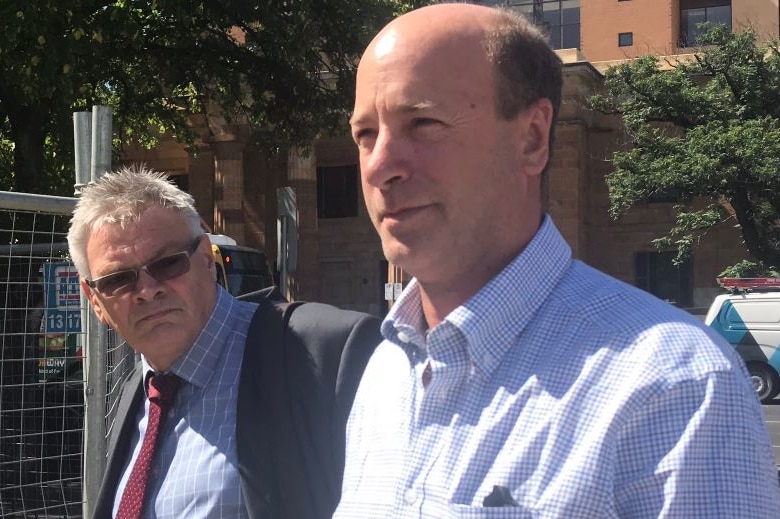 Peter Seppelt leaves court in Adelaide with his lawyer.