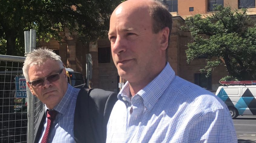 Peter Seppelt leaves court in Adelaide with his lawyer.