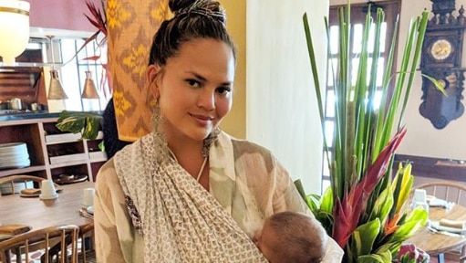 Model Chrissy Teigen with her baby in Bali.