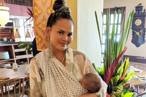 Model Chrissy Teigen with her baby in Bali.