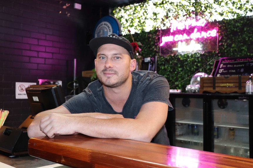 The operator of Coffs Harbour's Winxx nightclub, Samuel Phillips, behind the bar.