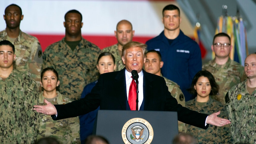President Donald Trump speaks before signing the National Defence Authorisation Act at Andrews Air Force Base.