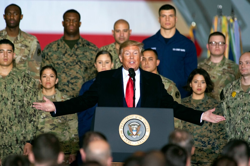 President Donald Trump speaks before signing the National Defence Authorisation Act at Andrews Air Force Base.