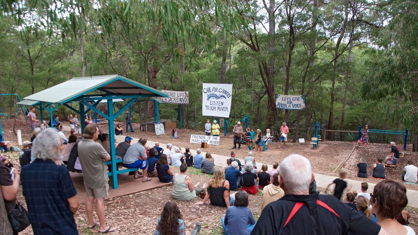 Members of the Margaret River community at a rally on the riverbank