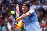 Solid form ... Milos Raonic plays a backhand against Viktor Troicki