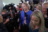 Deputy National Party leader Bridget McKenzie is surrounded by journalists at Parliament House.