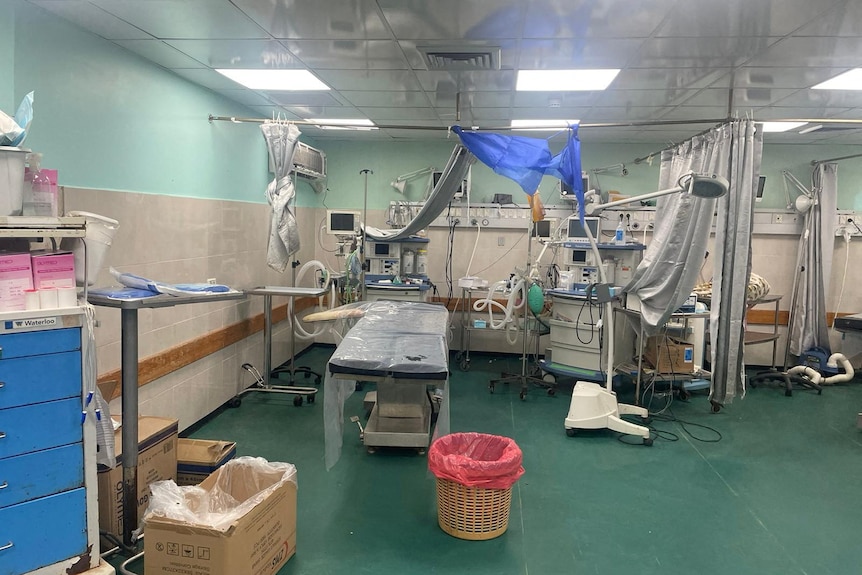 inside of hospital with a makeshift operating theatre in an open area
