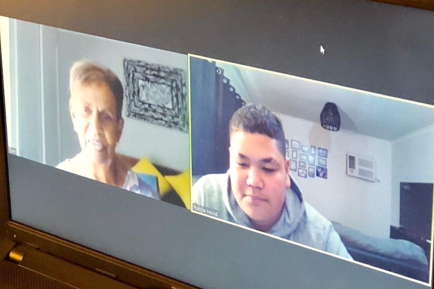 Woman and high school student on a zoom call.