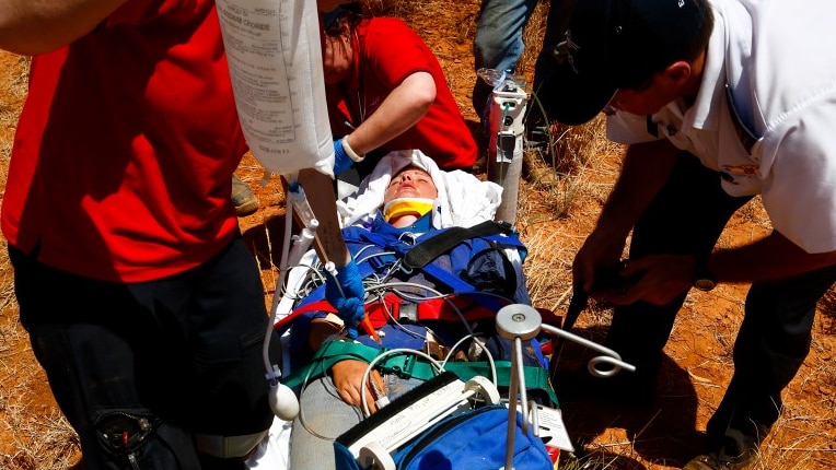 Farm worker loaded onto stretcher