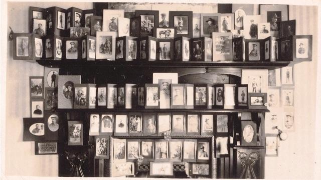 A wall of framed photographs