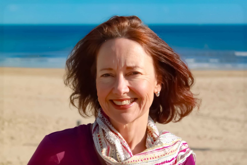 A close-up photo of Katherine Baldwin on a beach.