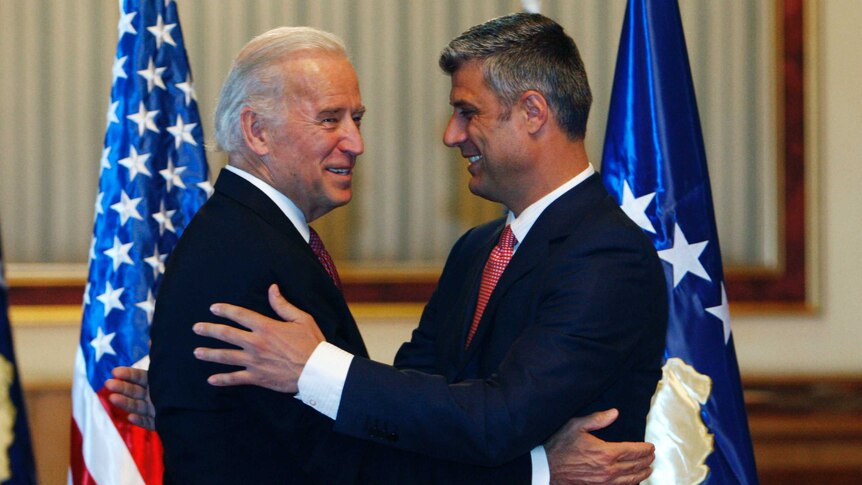U.S. Vice President Joe Biden (L) is welcomed by Kosovo's Prime Minister Hashim Thaci.