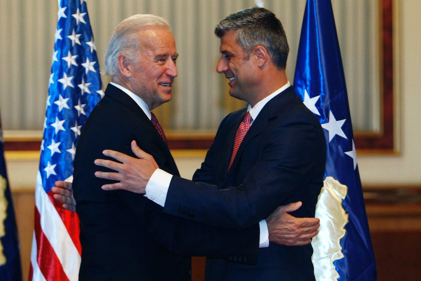 U.S. Vice President Joe Biden (L) is welcomed by Kosovo's Prime Minister Hashim Thaci.