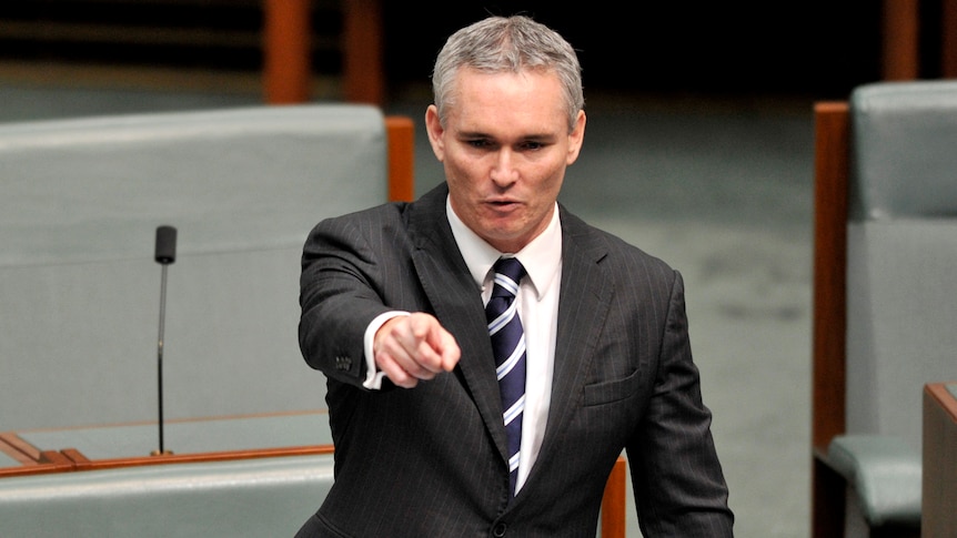 Craig Thomson gestures during address to parliament