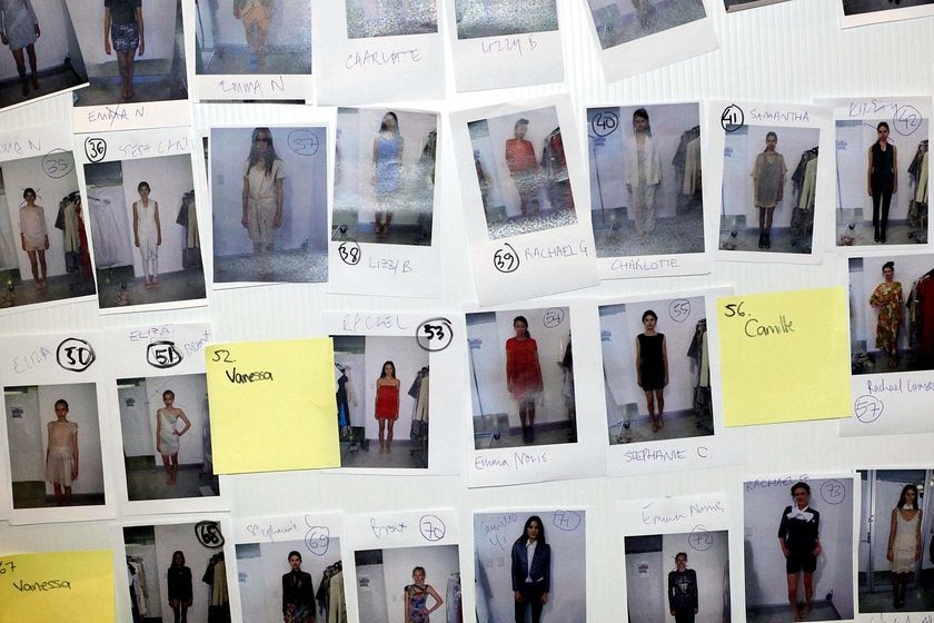Photos of models are pinned to a wall backstage at the Sydney Fashion Festival 2010 (Getty Images: Jennifer Polixenni Brankin)