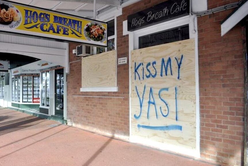 Message written on a boarded up shopfront in Cairns ahead of the arrival of Cyclone Yasi