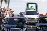 Pope Benedict XVI is driven through Santiago de Cuba.