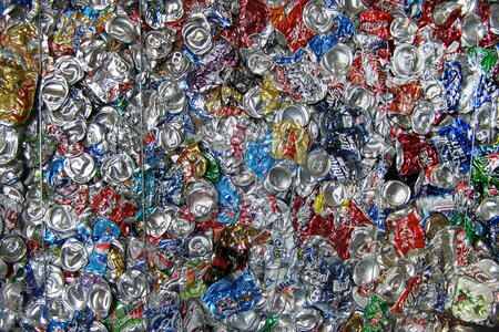 Hundreds of colourful crushed cans