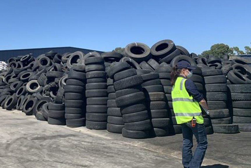 Large rows of stacked tyres.