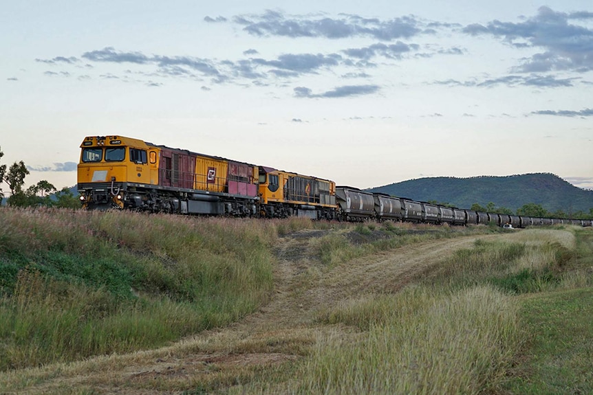 a coal train at sunset