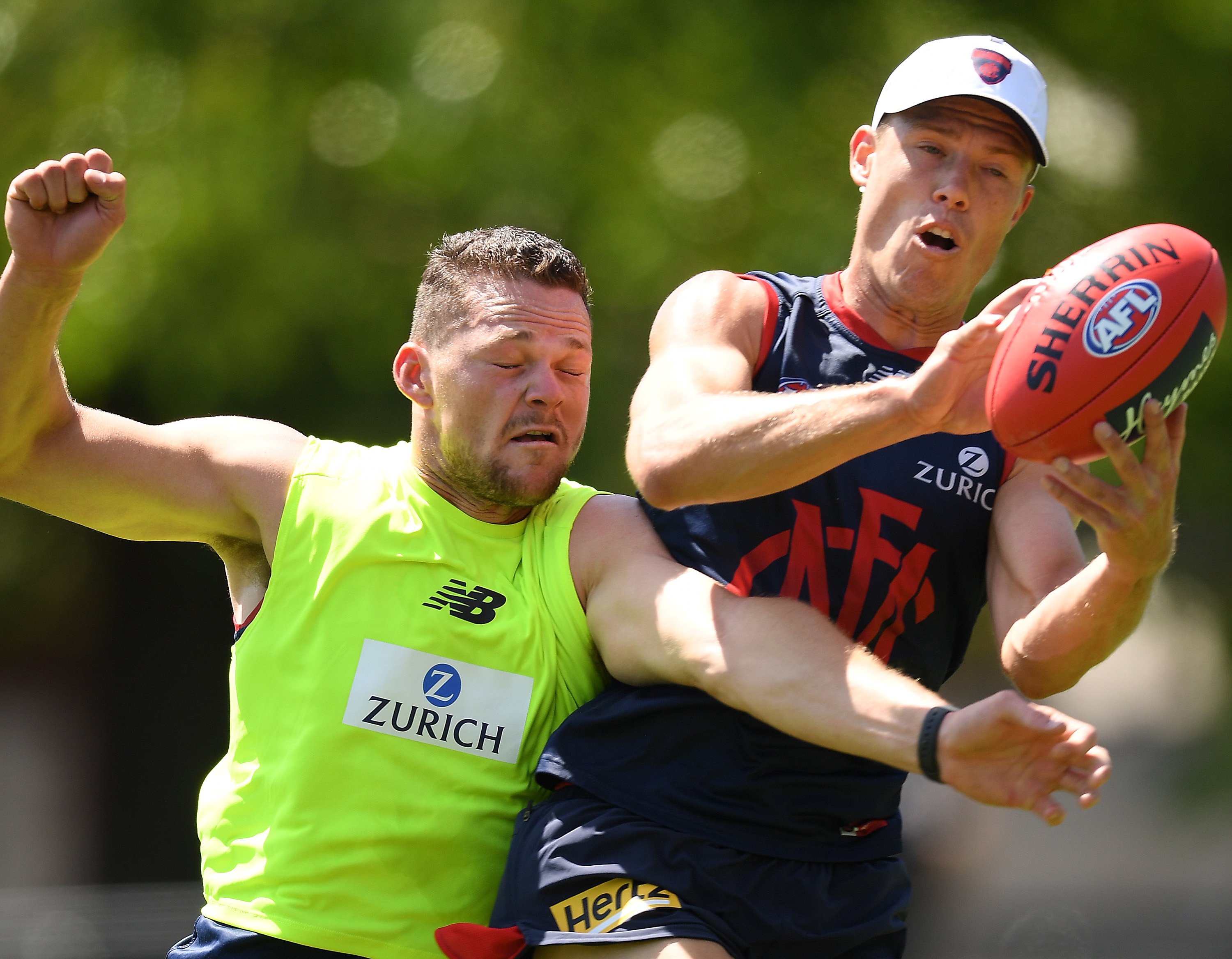 Steven May and Jake Melksham compete for a mark in training kit