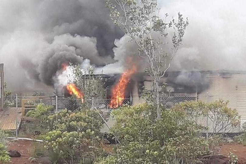 Fire erupts at a small building at a mine site.