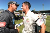 Arthur shakes hands with Hussey