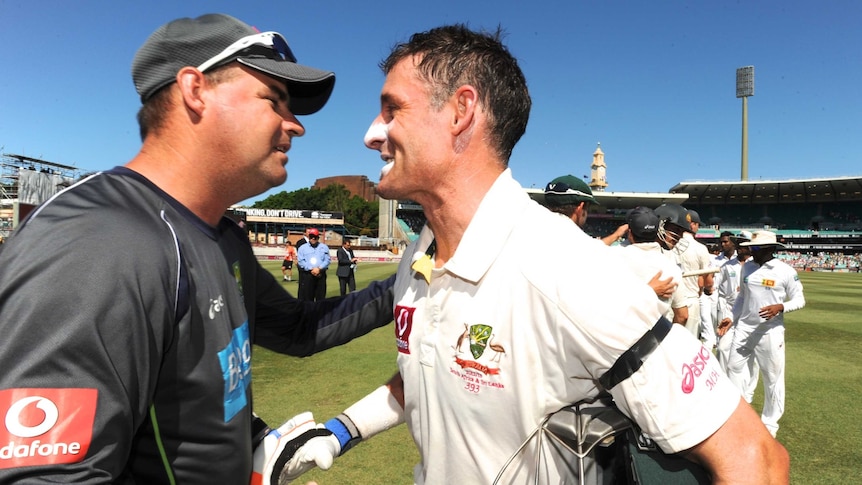 Well done ... Mickey Arthur (L) shakes hands with Michael Hussey after his final Test appearance