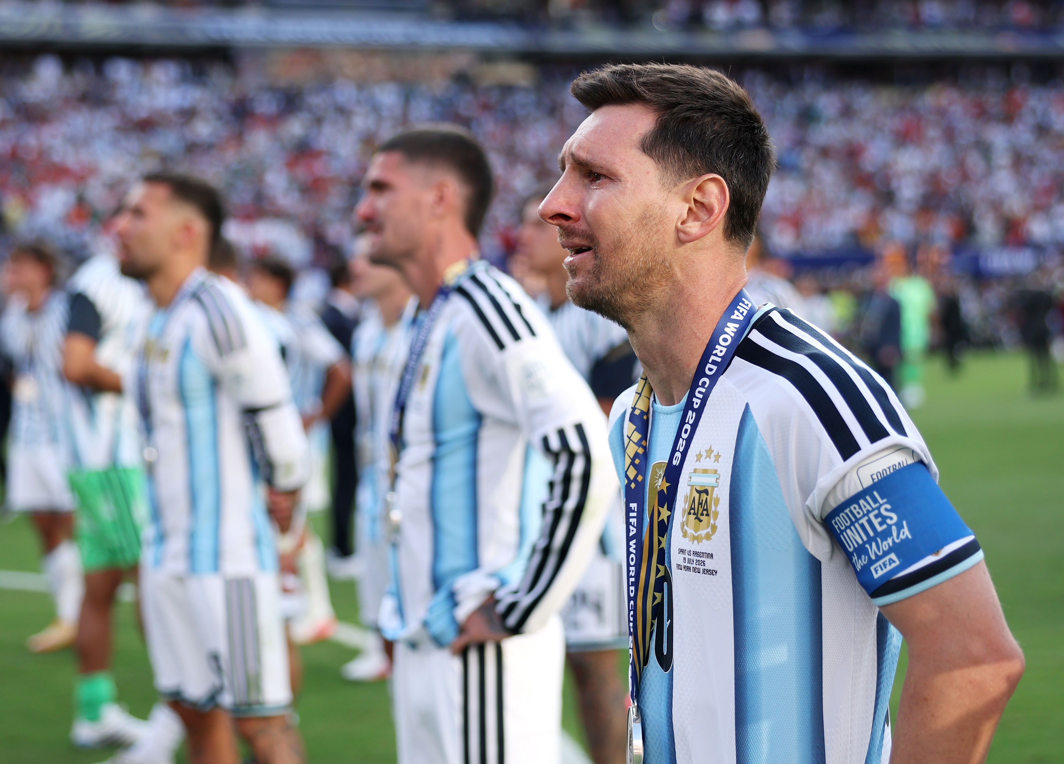 Lionel Messi watches on in tears