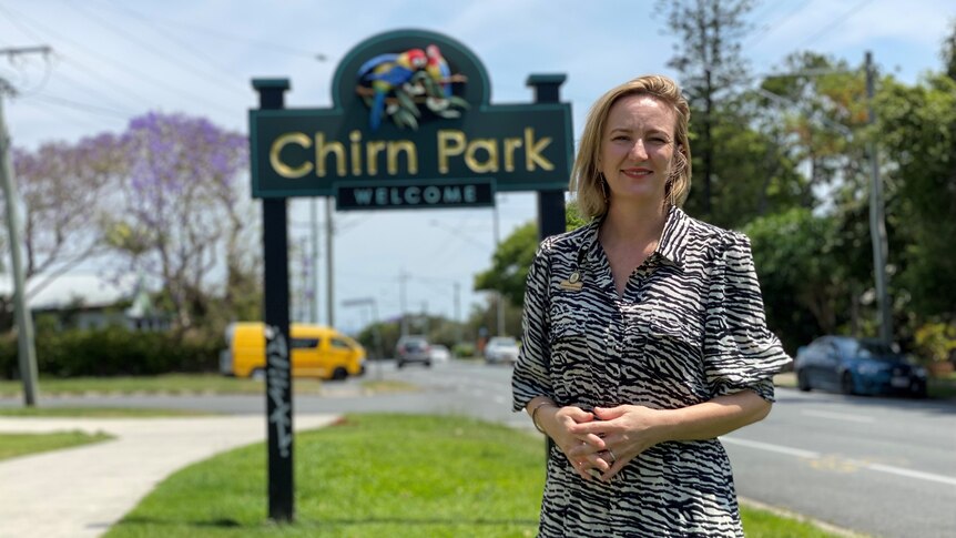 Woman standing in front of a sign saying Chirn Park.