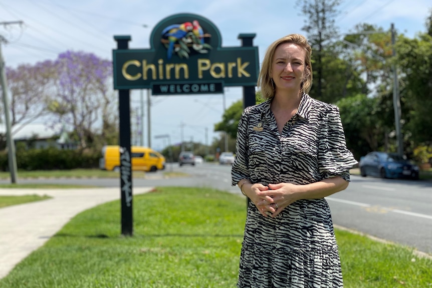 Woman standing in front of a sign saying Chrin Park.