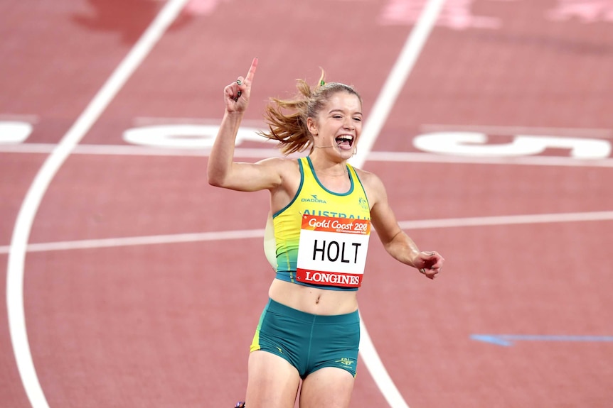 Isis Holt of Australia celebrates a gold medal win in the women's T35 100m on day seven.