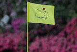 A close-up shot of the top of a flag on the green at Augusta National during the Masters.