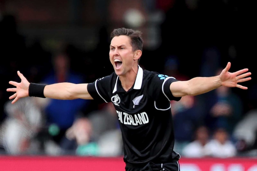 New Zealand bowler Trent Boult screams an appeal for a wicket with his arms out wide in the Cricket World Cup final.