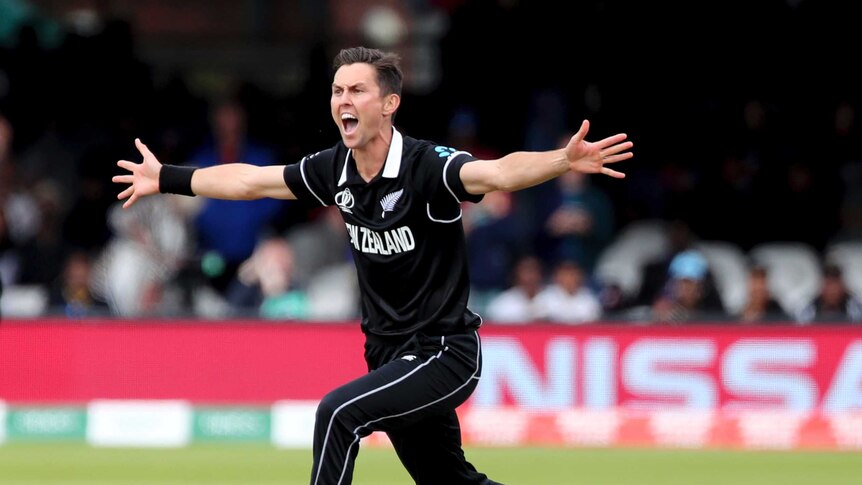 New Zealand bowler Trent Boult screams an appeal for a wicket with his arms out wide in the Cricket World Cup final.