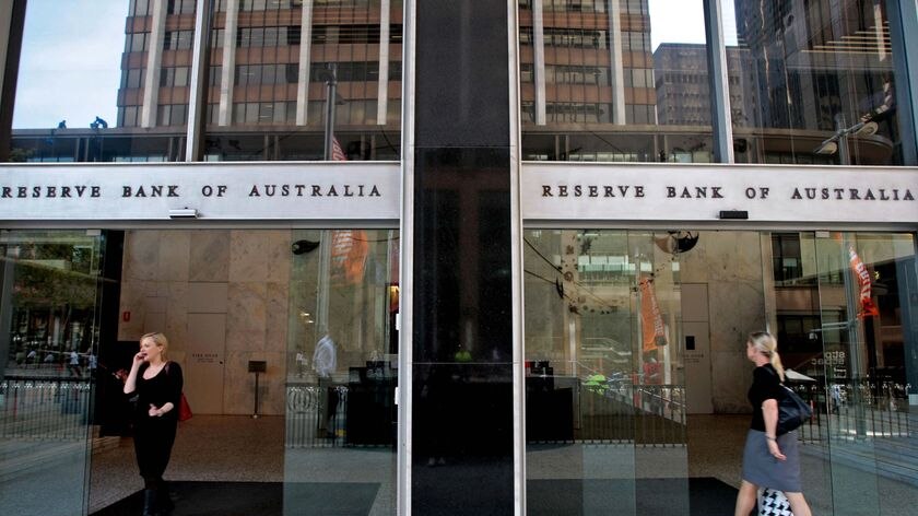People walk in and out of the Reserve Bank Australia