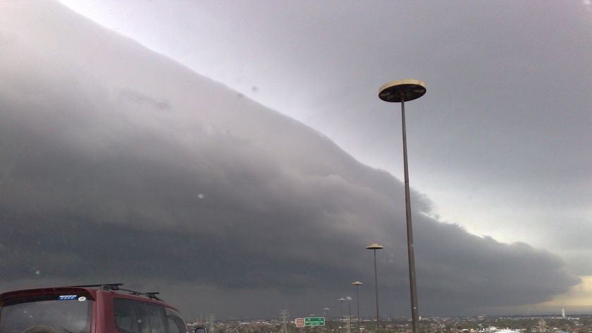 A storm front travels across West Gate Bridge in Melbourne