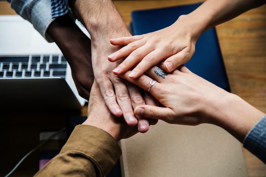 Hands together in a circle.