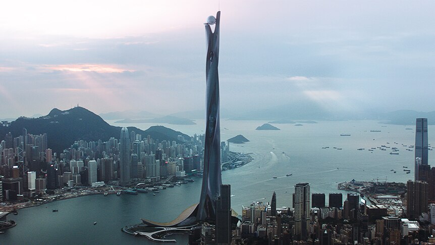 Colour still image from 2018 film Skyscraper of futuristic fictional skyscraper The Pearl on the harbour's edge in Hong Kong.