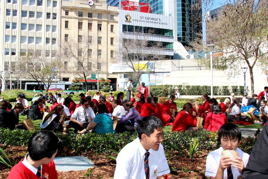 Students eating lunch outside their new high rise school in the Perth CBD