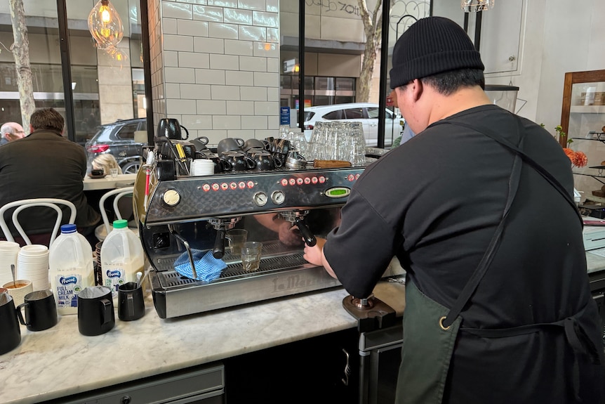 a barista making coffee