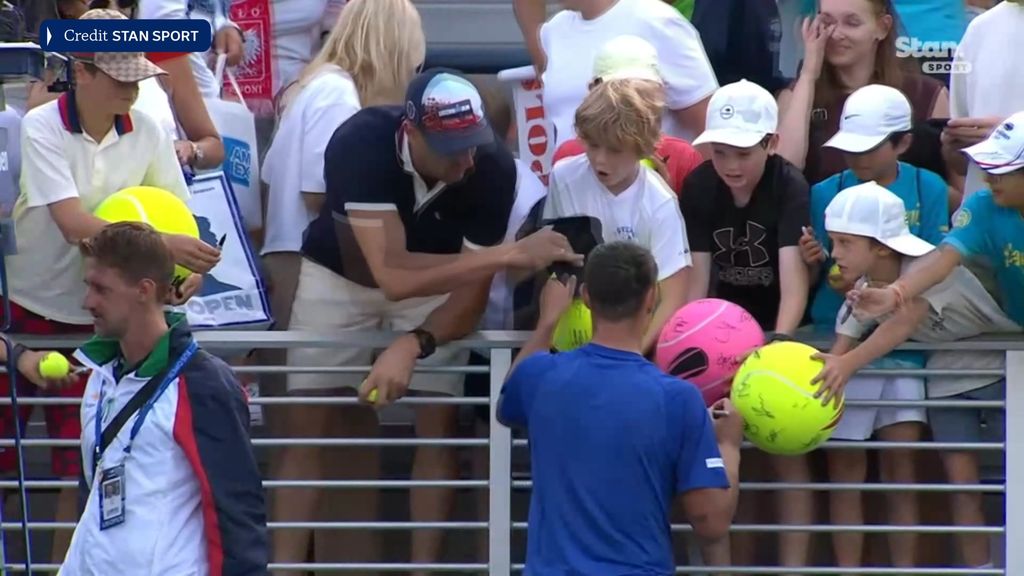 Tennis player signing authographs