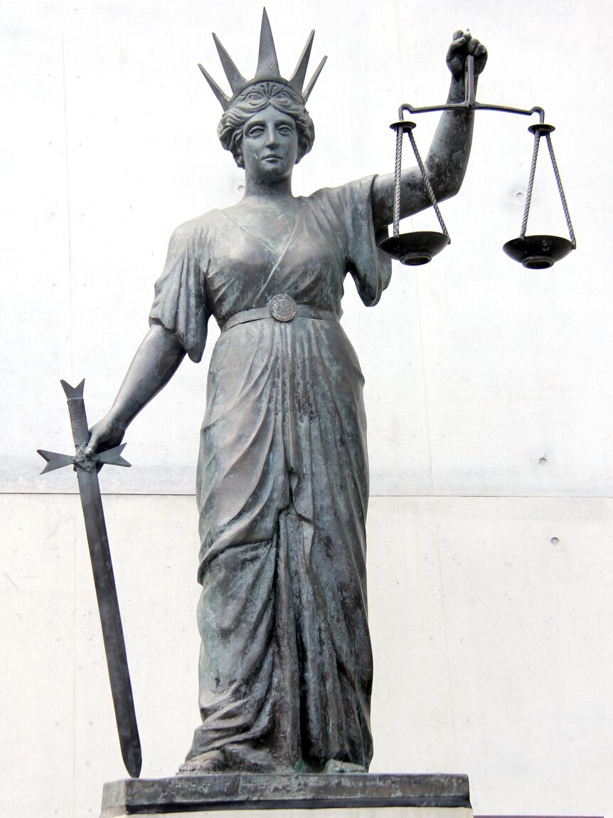The scales of justice outside the Supreme Court in Brisbane.