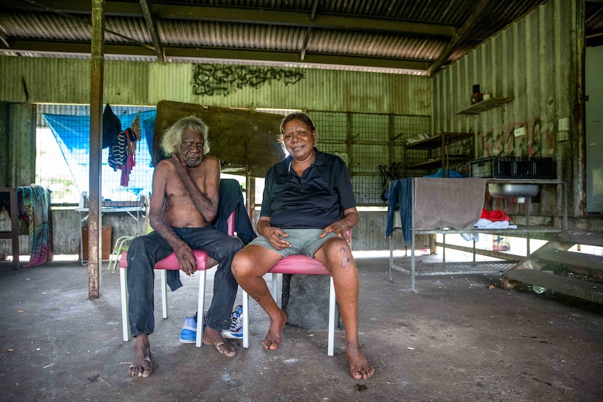 Residents Eric and Maxine sitting inside a tin shack