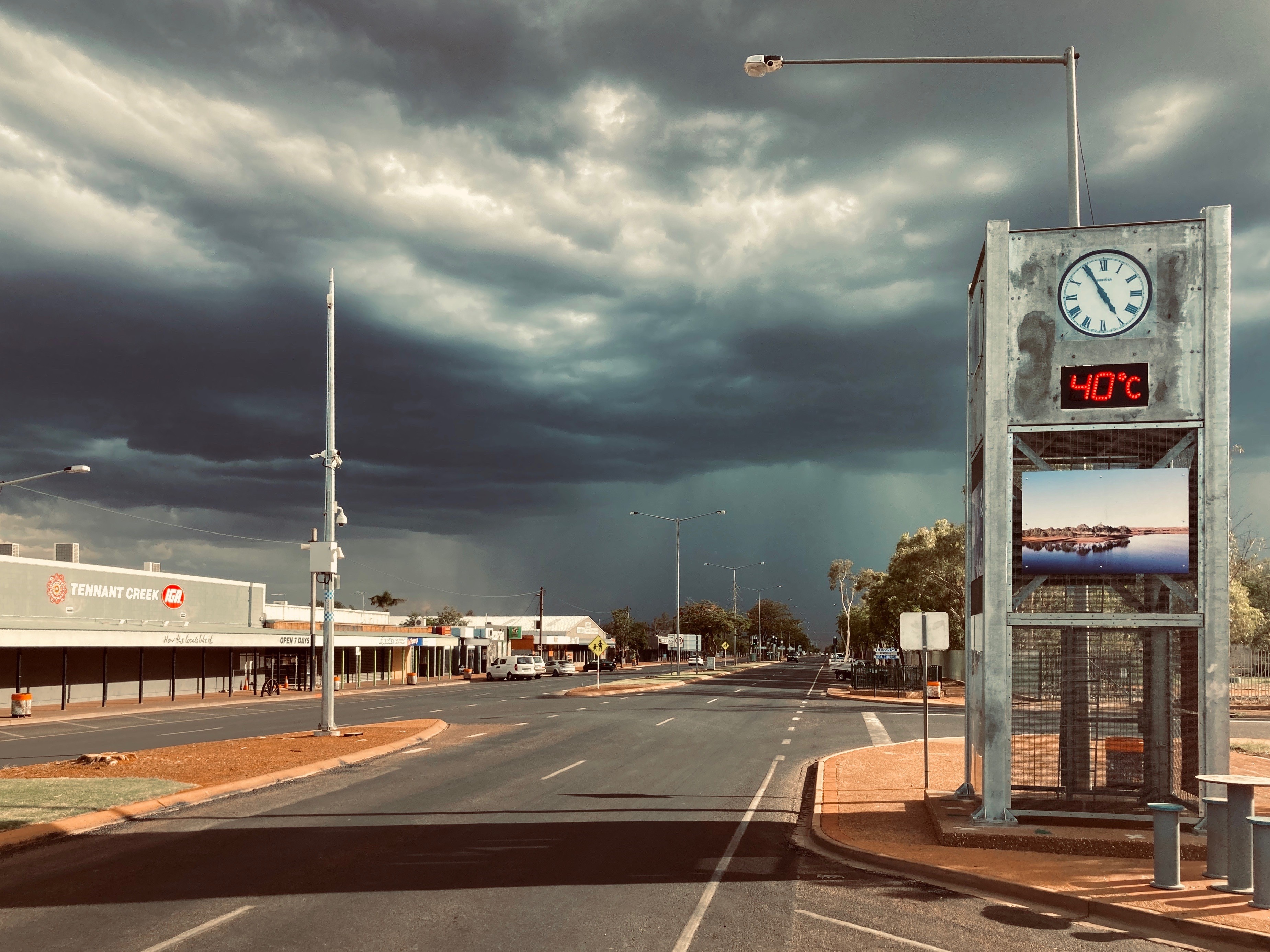 Storm clouds over the main drag of an outback town.